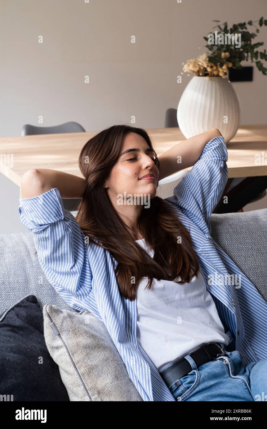 Barefoot girl lying on couch hi-res stock photography and images - Alamy