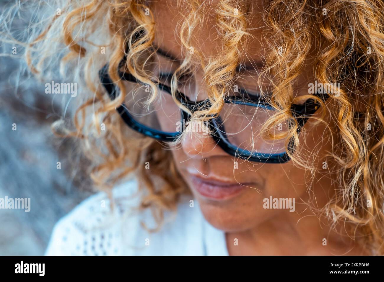 Woman face looking down profile hi-res stock photography and images - Alamy