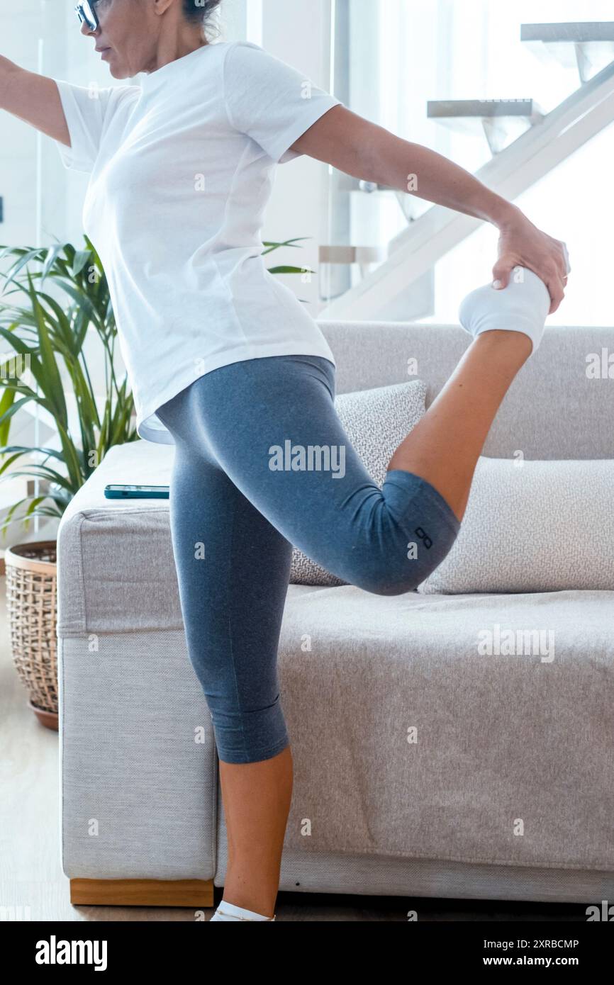 One woman doing fitness workout at home in indoor healthy leisure ...