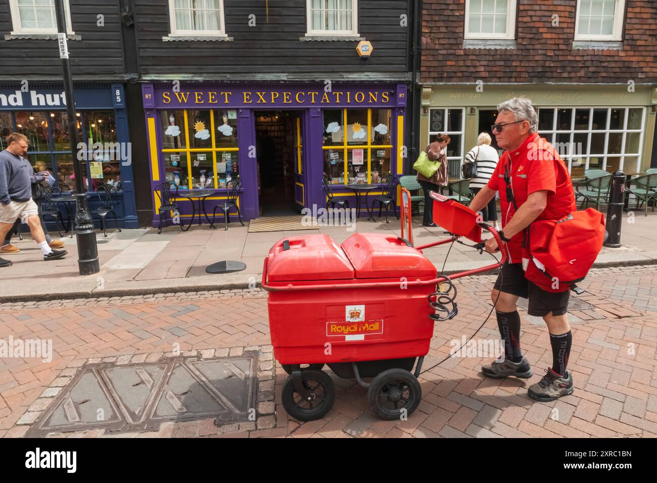 England, Kent, Rochester, Postman delivering Mail Stock Photo
