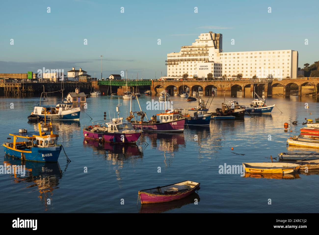 England, Kent, Folkestone, Folkestone Harbour Fishing Boats and Grand Burstin Hotel Stock Photo