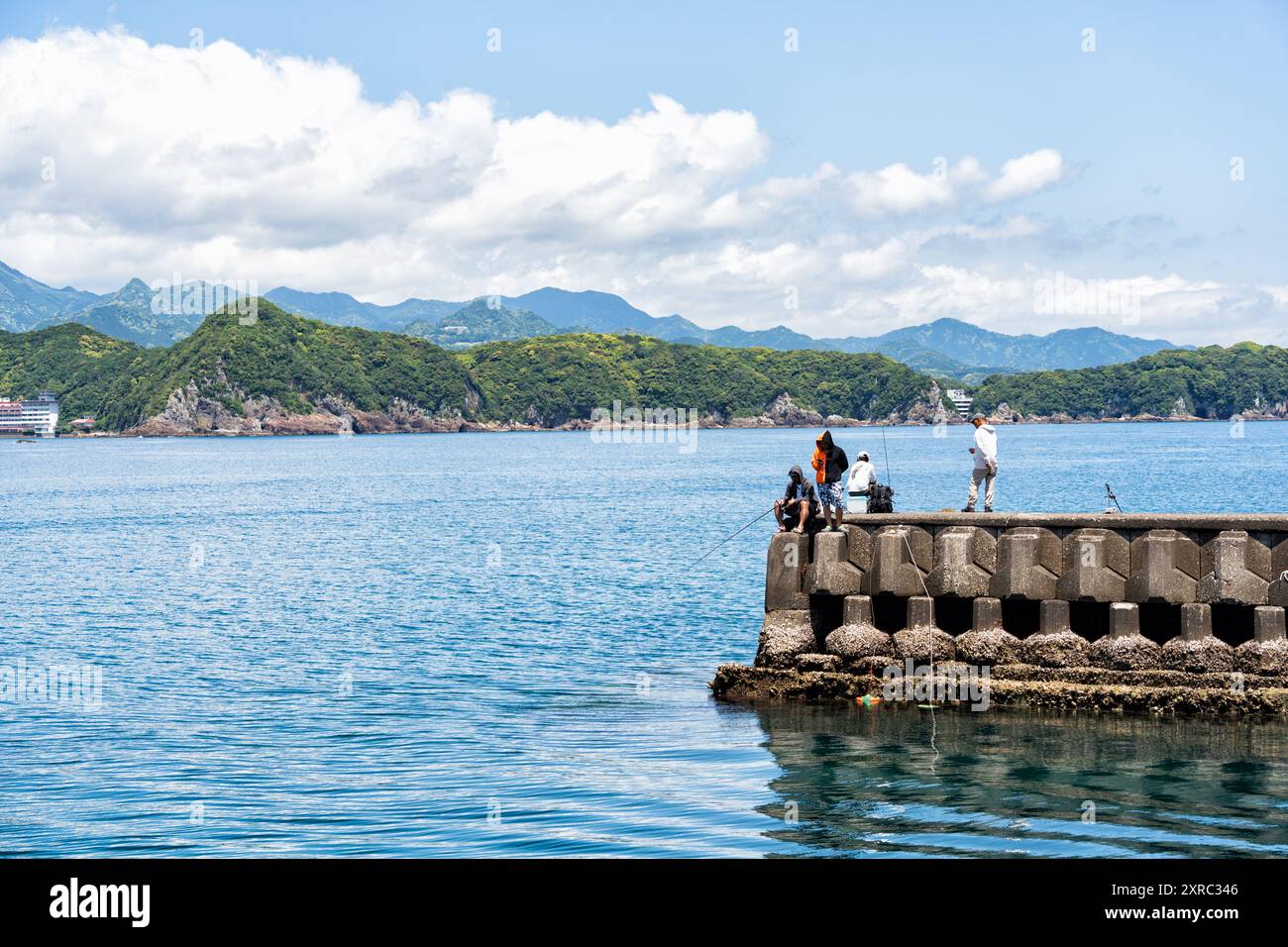 Taiji, Japan - 05.10.2024: Many fishermans fishing from the pier in ...