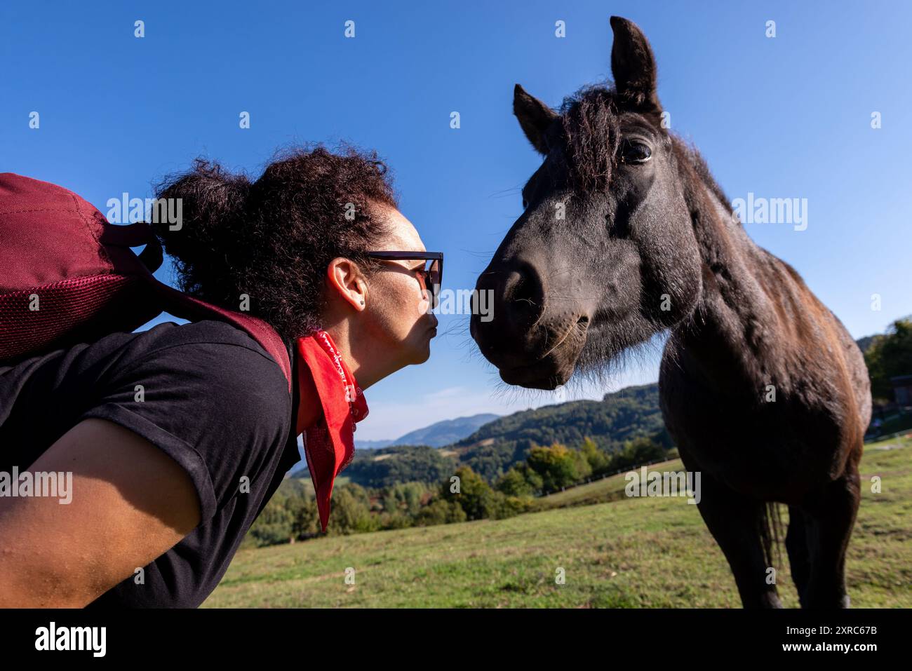 Happy tourist woman kissing hi-res stock photography and images - Alamy