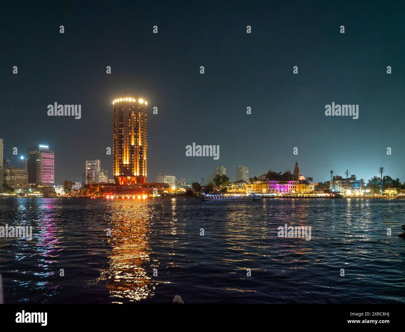 Night view of the city of Cairo from a boat on the Nile River, Egypt ...