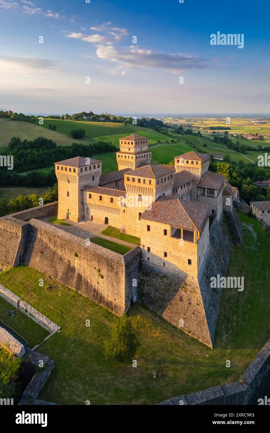 Aerial view of castle of Torrechiara during a summer sunset, Langhirano, Parma province, Emilia Romagna, Italy, Europe, Stock Photo