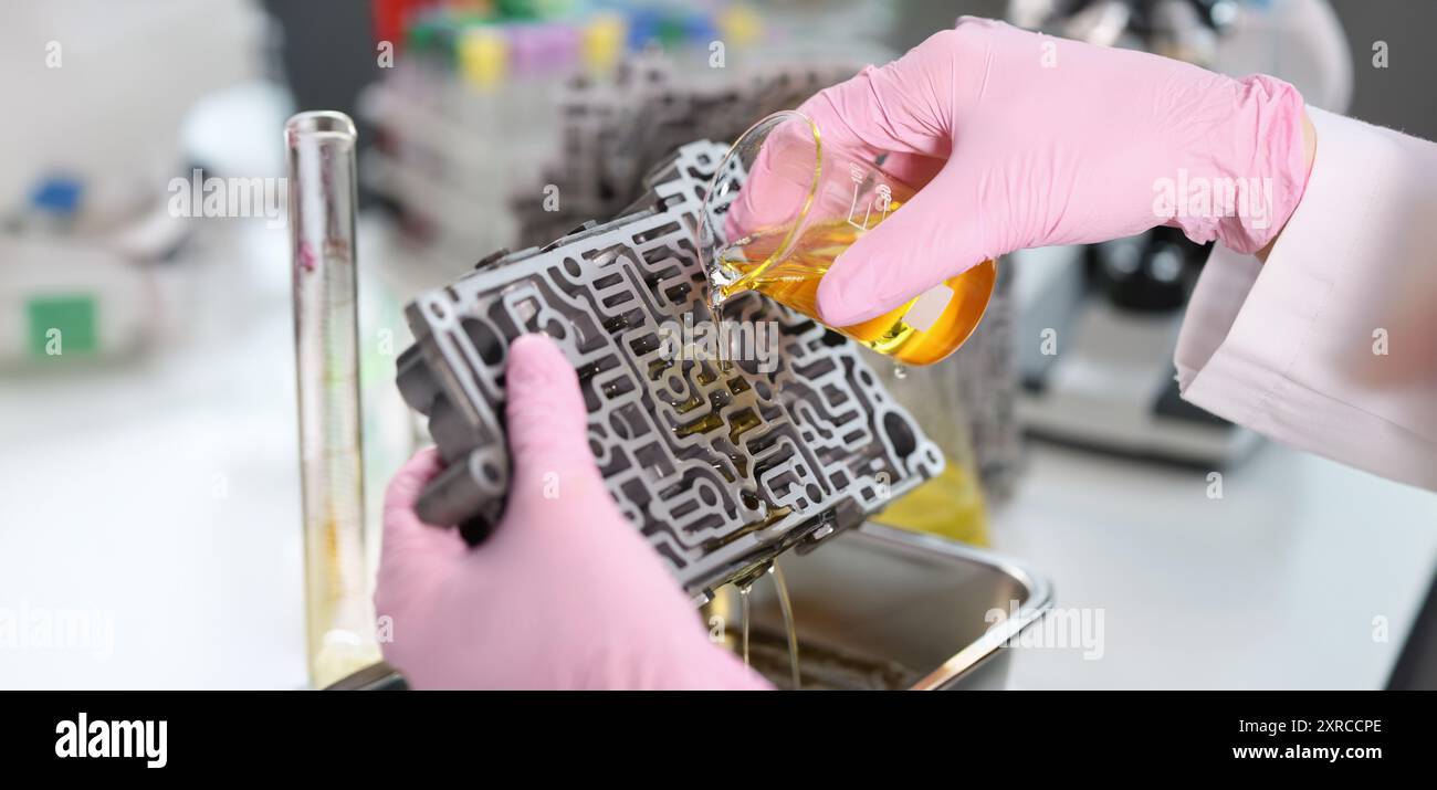 Assistant pours yellow liquid hi-res stock photography and images - Alamy
