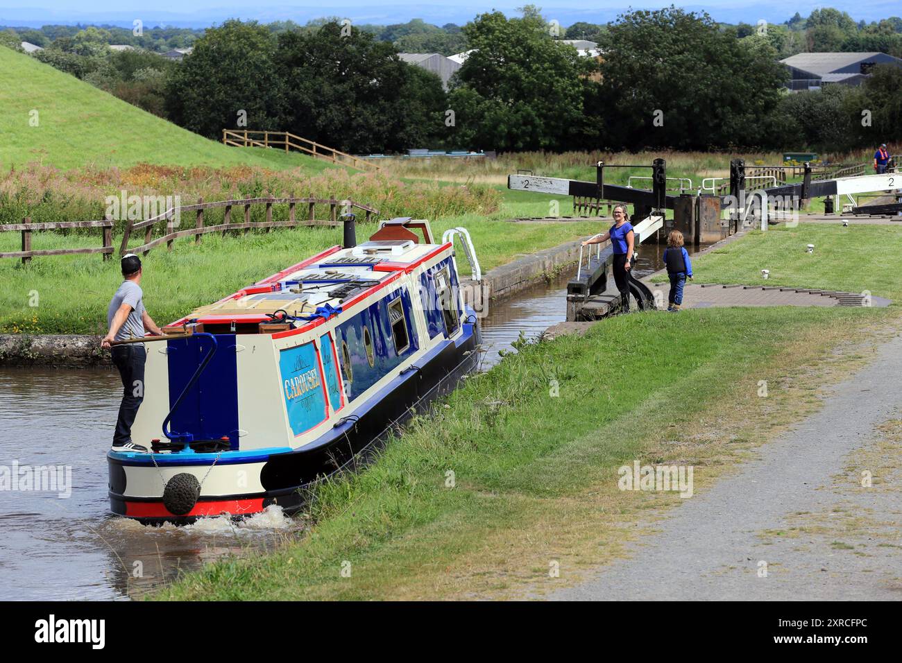 Canal narrowboat passing through Hurleston locks on the Llangollen canal before the junction with the Shropshire union canal Stock Photo