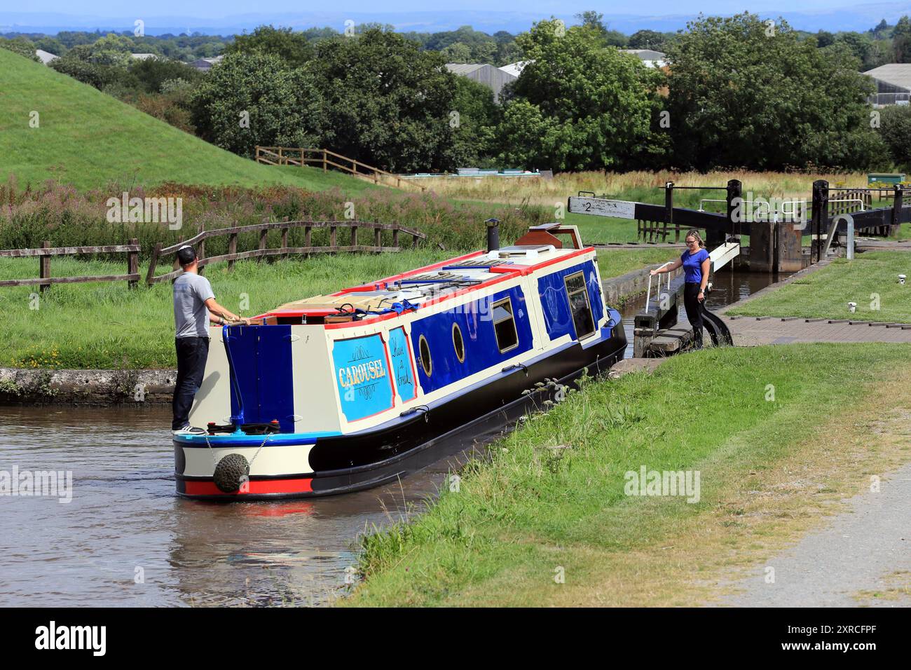 Canal narrowboat passing through Hurleston locks on the Llangollen canal before the junction with the Shropshire union canal Stock Photo