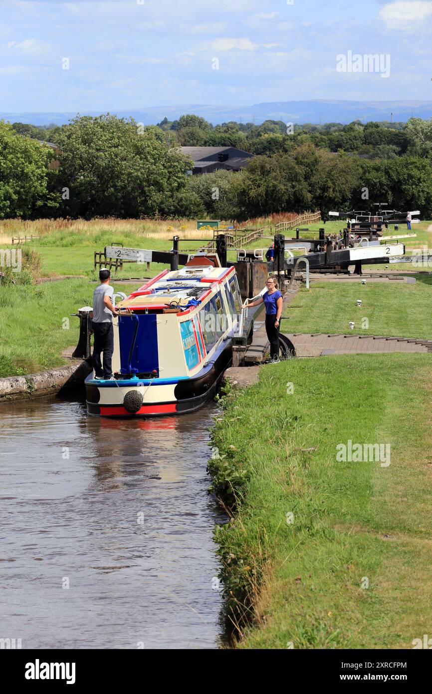 Canal narrowboat passing through Hurleston locks on the Llangollen canal before the junction with the Shropshire union canal Stock Photo