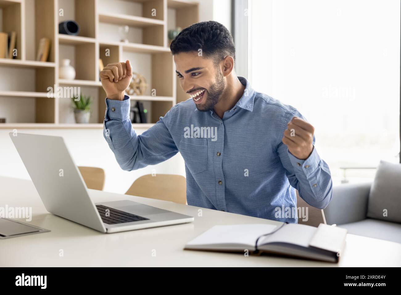 Cheerful young arab man victory hi-res stock photography and images - Alamy