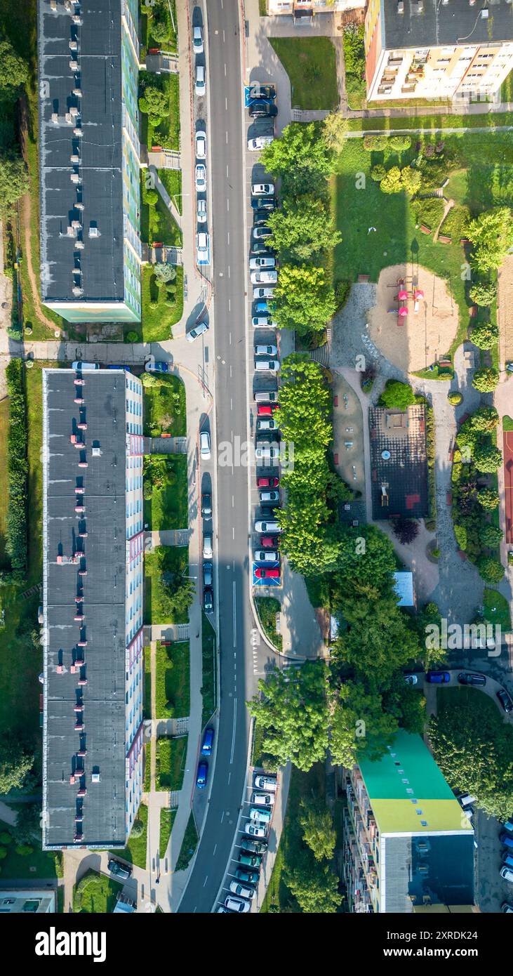 Aerial view of residential neighborhood with parked cars and playground ...