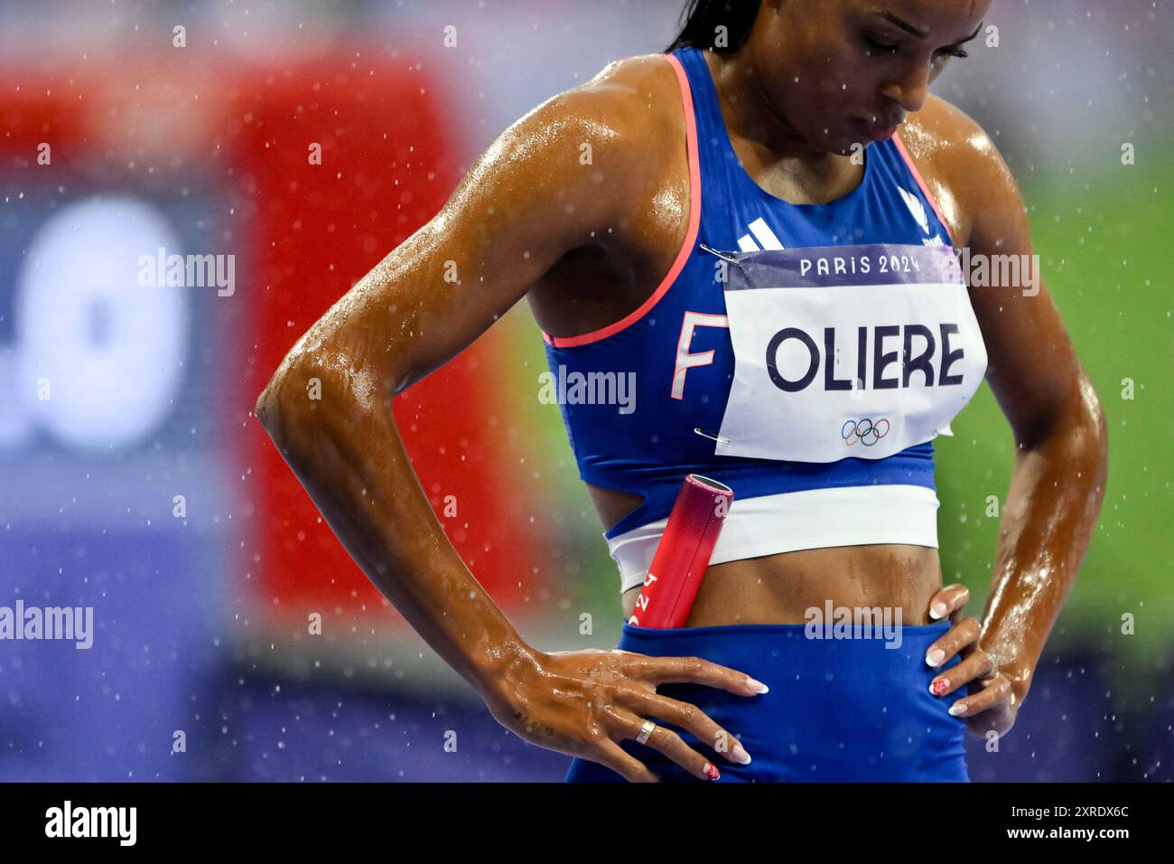 Oriann Oliere of France, under the rain, prepares to compete in the