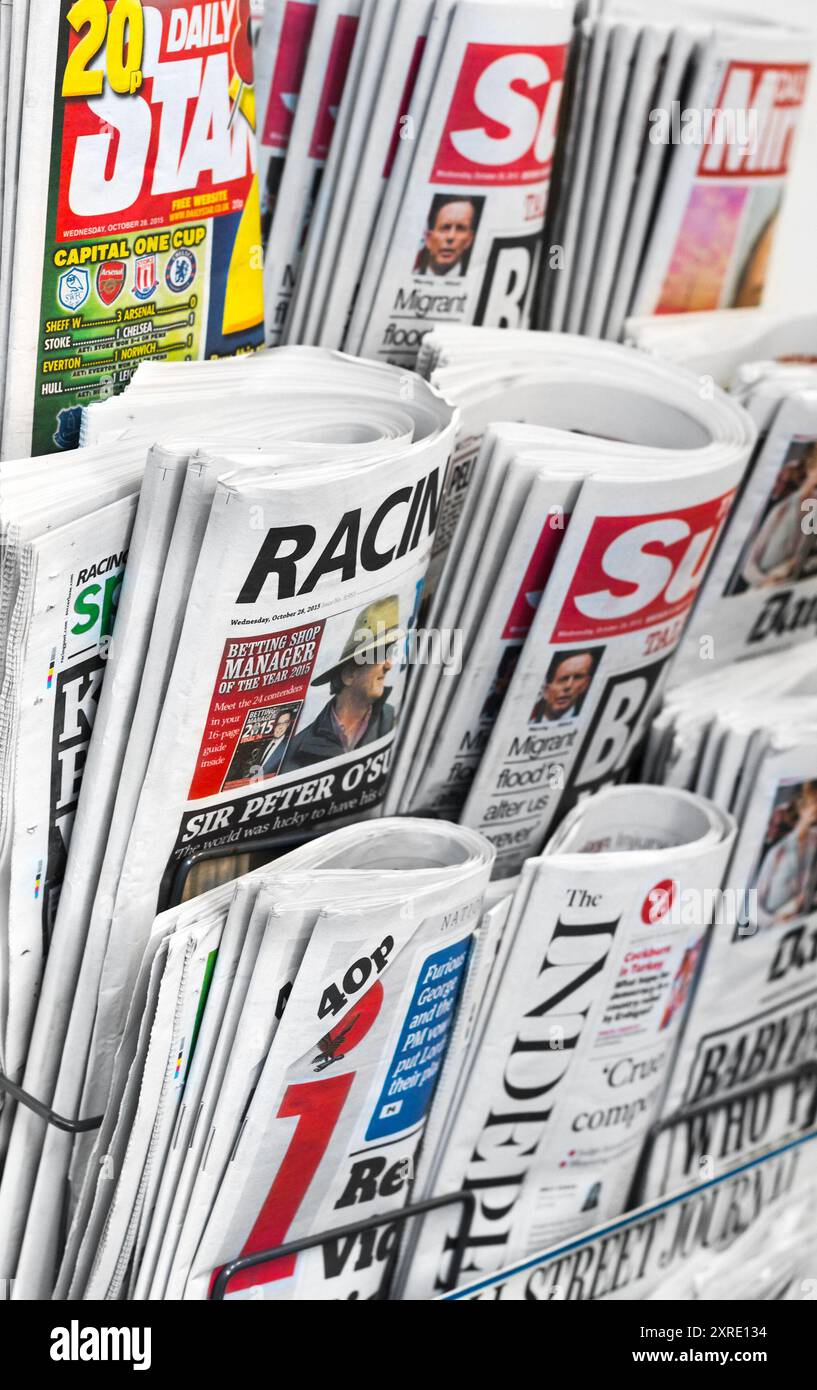 Newspaper rack found in central London, featuring several well known British tabloid newspapers, otherwise known as 'the popular press'. Stock Photo