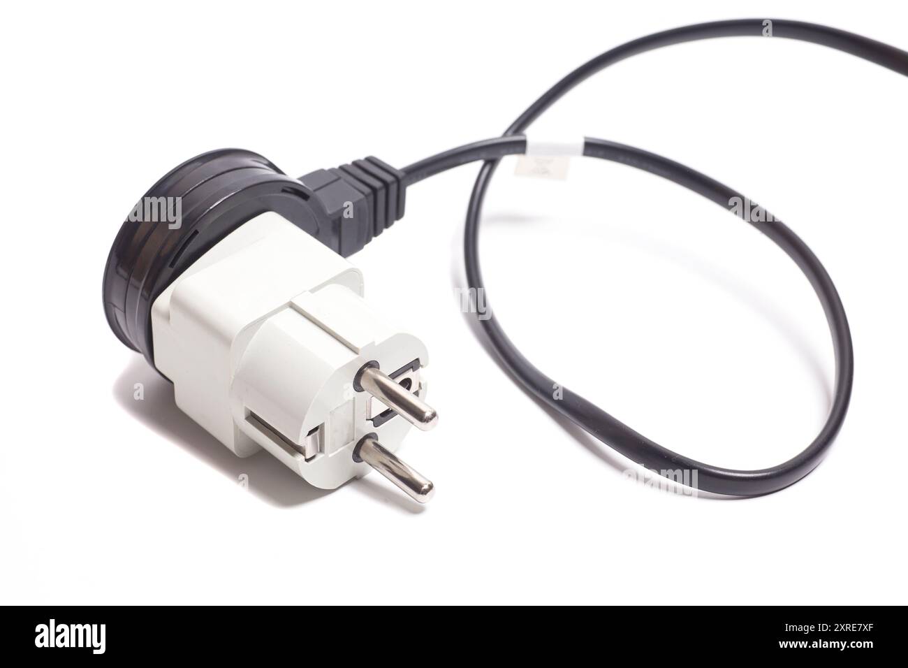 Power cable with universal white plug adapter isolated on white Stock Photo