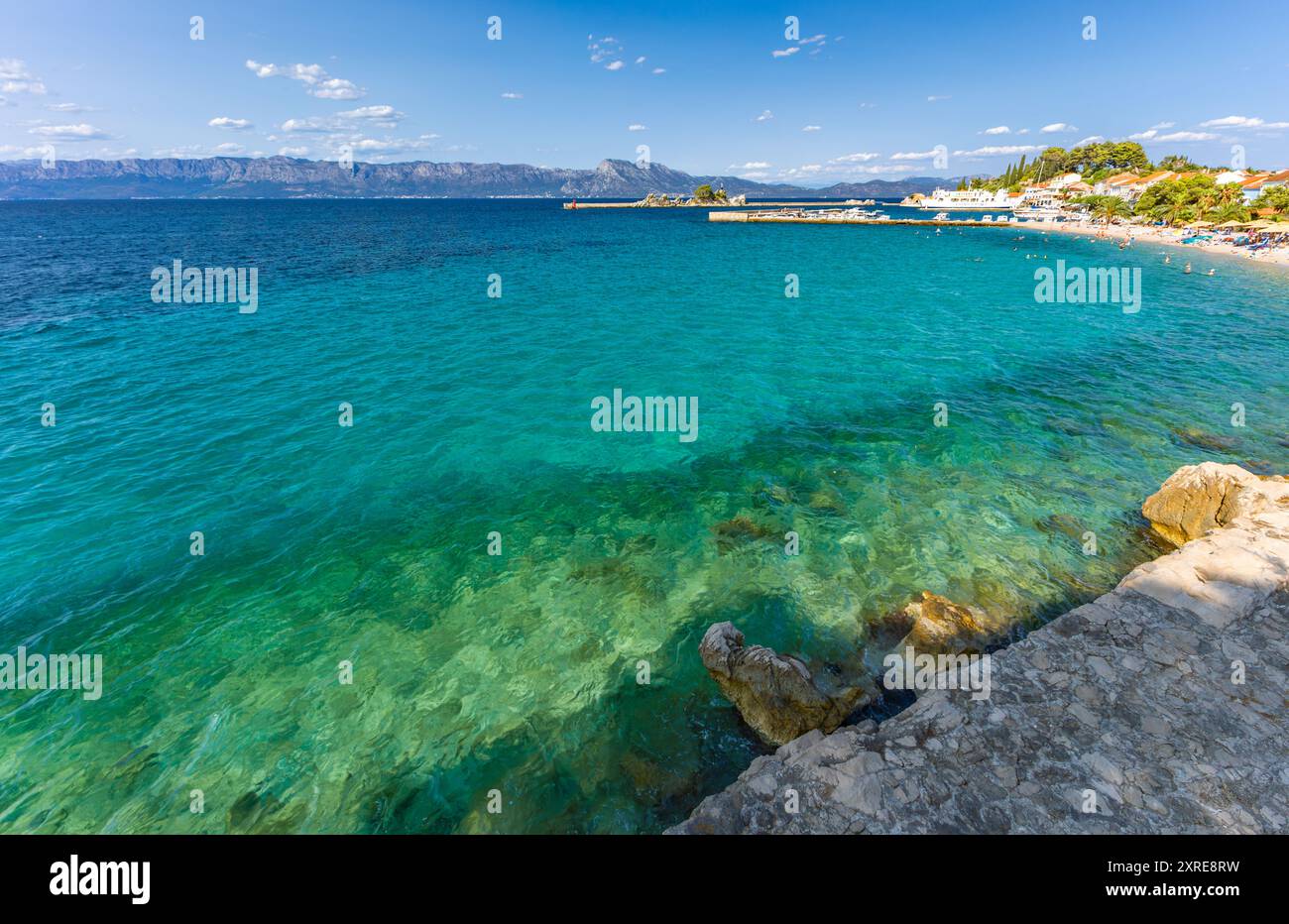 Port in Trpanj, Peljesac Peninsula in Croatia, view of the statue of the Virgin Mary, rough Adriatic sea Stock Photo