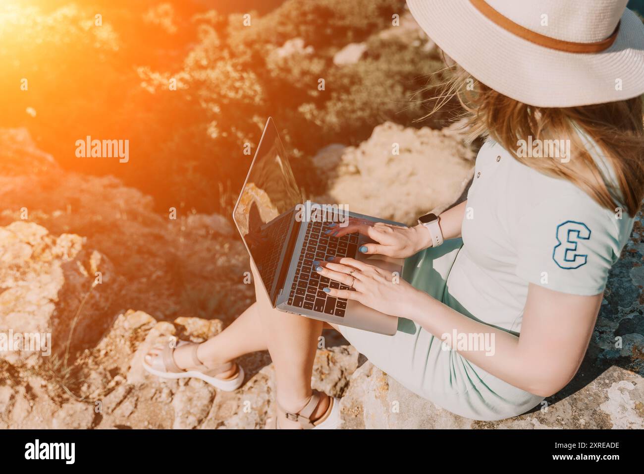 Woman on rocky mountain using hi-res stock photography and images - Alamy