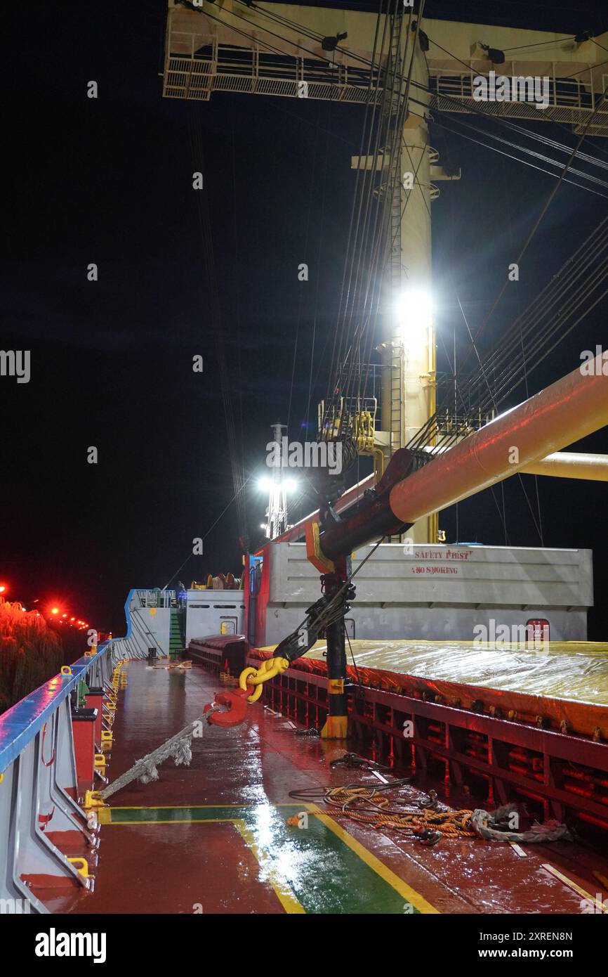 Deck of a Cargo Ship at Night in Sulina Harbor, Romania Stock Photo