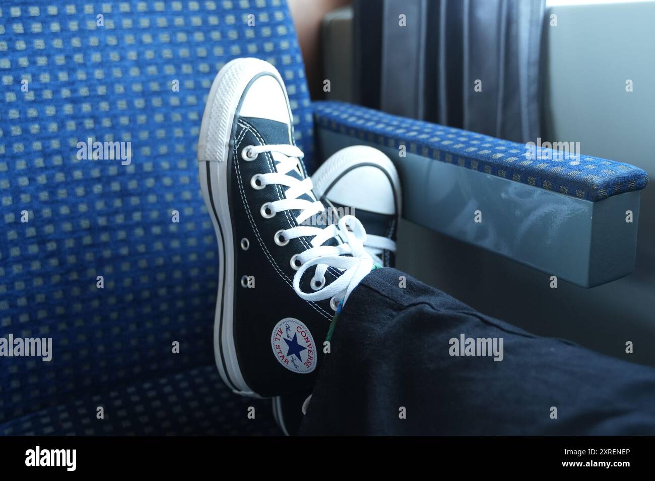 Converse sneakers on train journey Tulcea Romania Stock Photo Alamy