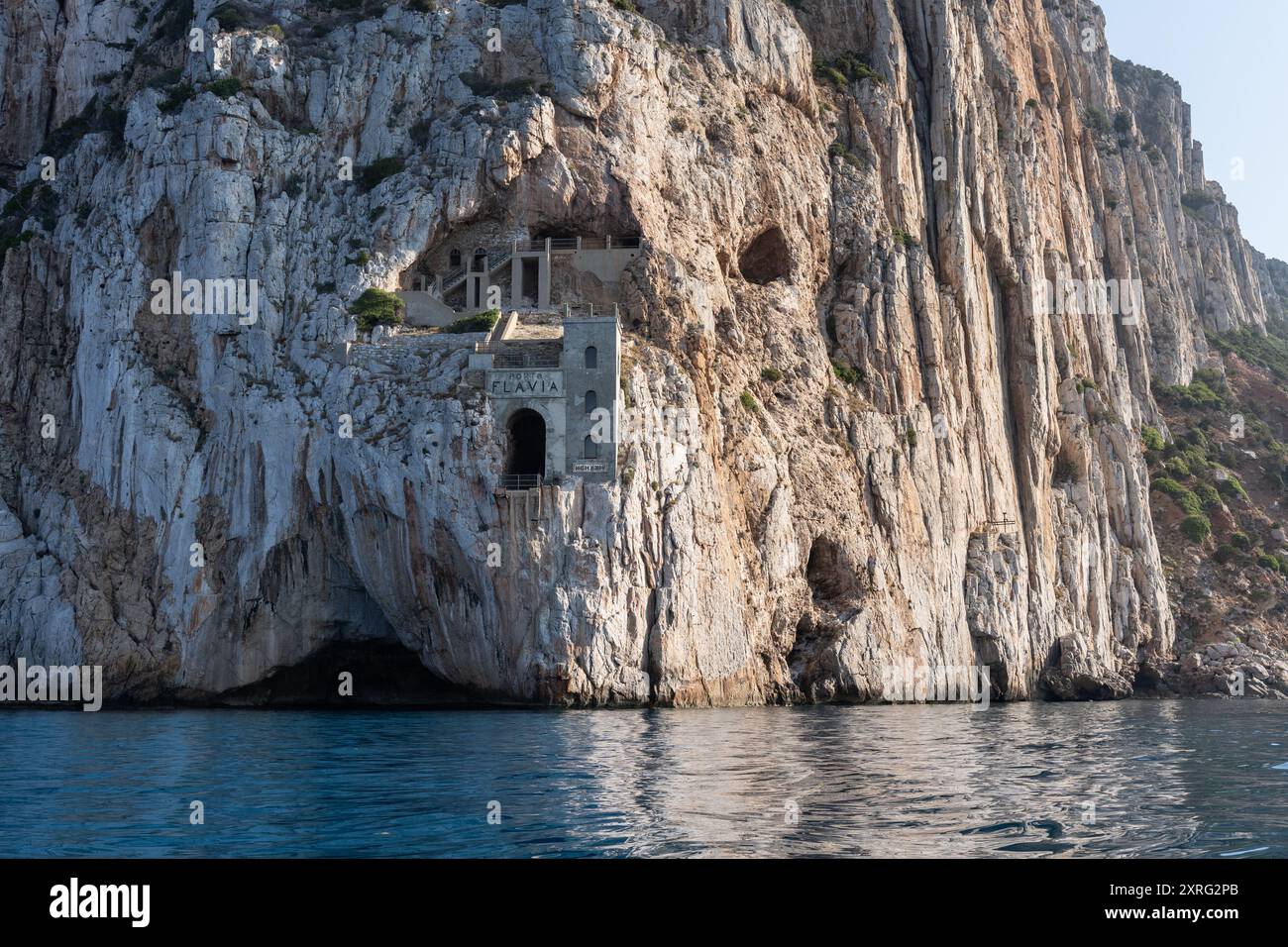Facade Of Porto Flavia In The Middle Of The Cliff Over De Water A Zinc 