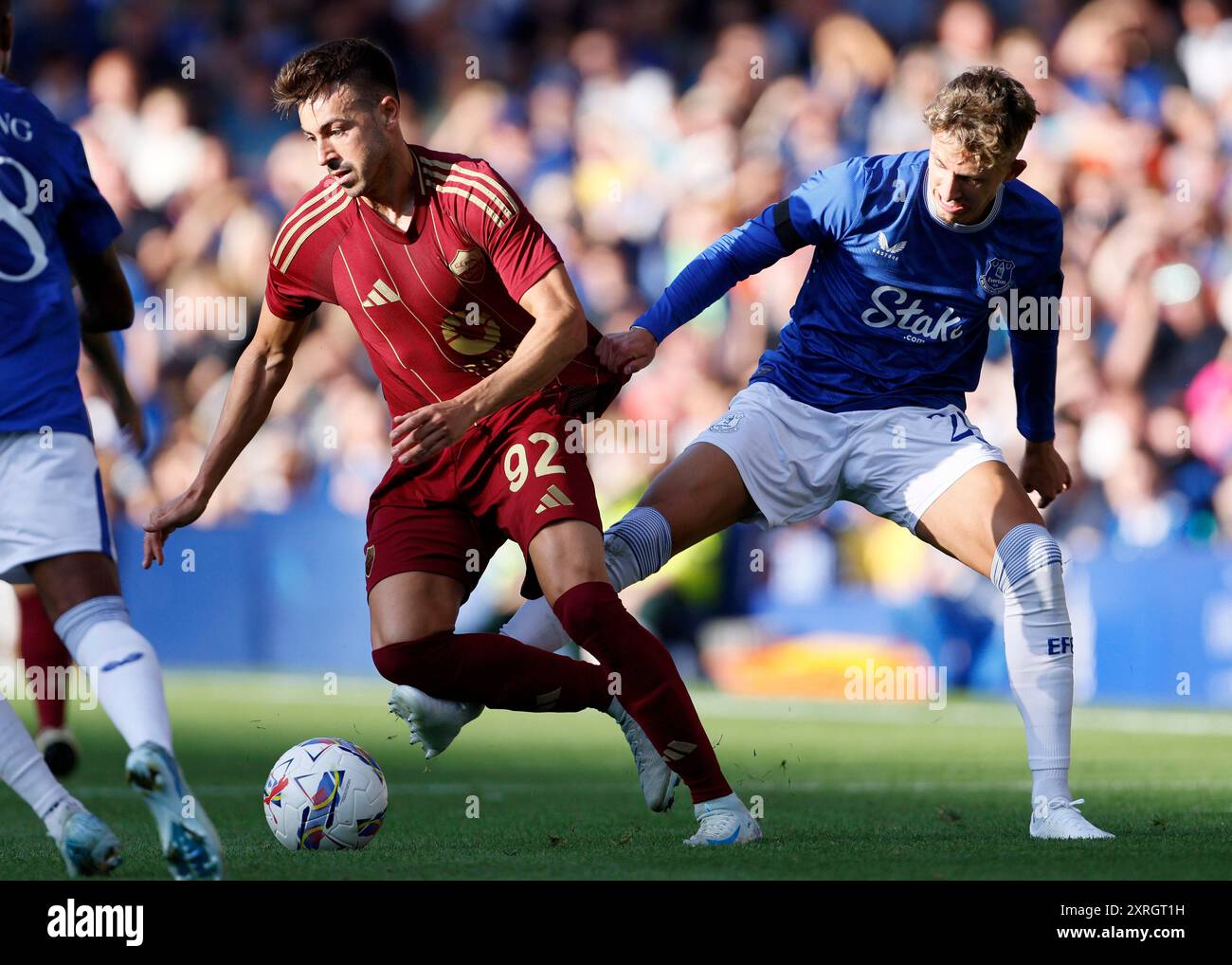 Roma's Stephan El Shaarawy (L) and Everton's Jesper Lindstrom challenge