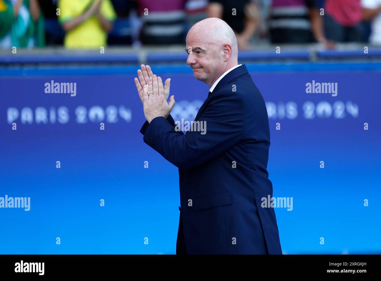 FIFA president Gianni Infantino applauds as he arrives for the medal