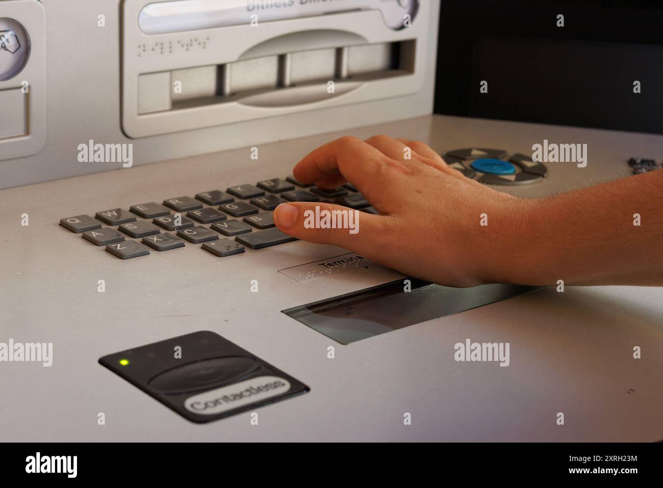 Using an ATM keypad during a financial transaction Stock Photo - Alamy