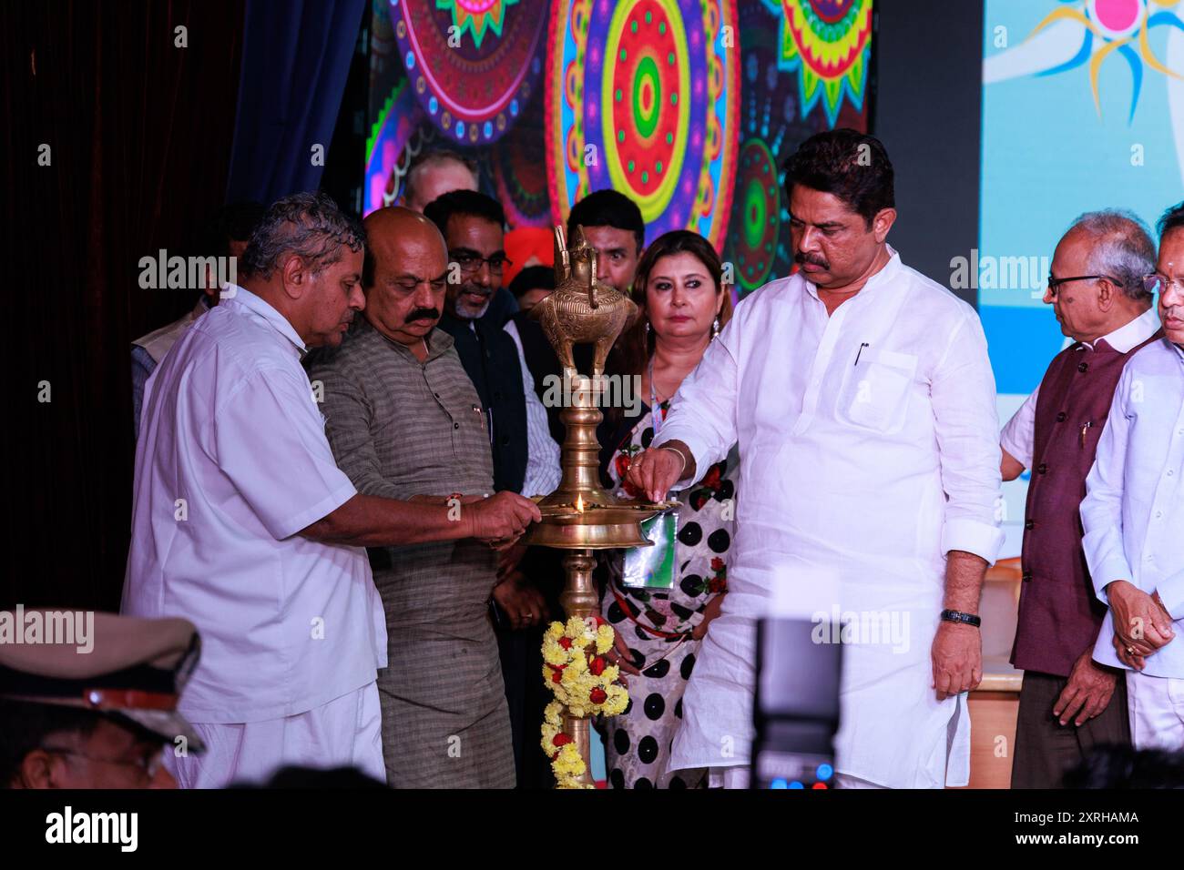 Then Karnataka Chief Minister, Basavaraj Bommai and other dignitaries lighting the lamp at WCYS 2022 organised by IYSF at S-VYASA, Bengaluru Stock Photo