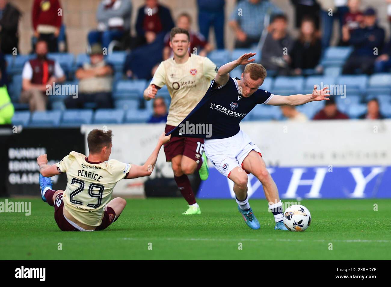 Dens Park, Dundee, UK. 10th Aug, 2024. Scottish Premiership Football, Dundee versus Heart of Midlothian; James Penrice of Heart of Midlothian pulls down Scott Tiffoney of Dundee Credit: Action Plus Sports Images/Alamy Live News Credit: Action Plus Sports/Alamy Live News Stock Photo