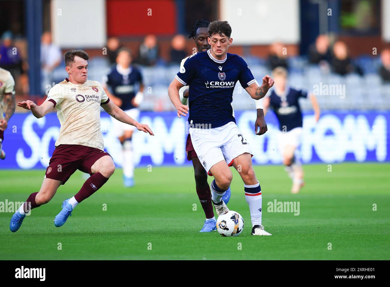 Dens Park, Dundee, UK. 10th Aug, 2024. Scottish Premiership Football, Dundee versus Heart of Midlothian; Seb Palmer-Houlden of Dundee takes on James Penrice of Heart of Midlothian Credit: Action Plus Sports Images/Alamy Live News Credit: Action Plus Sports/Alamy Live News Stock Photo