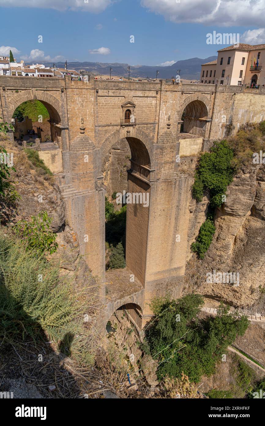 The iconic Puente Nuevo Bridge in Ronda, Spain, gracefully arches over ...