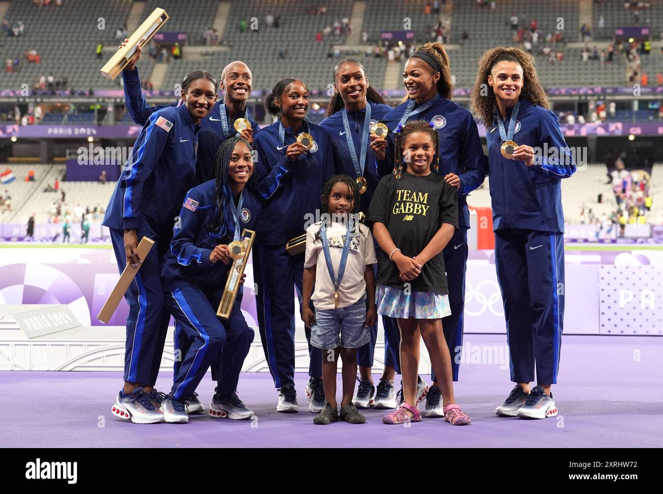 Members of the USA team with their gold medals after victory in the ...
