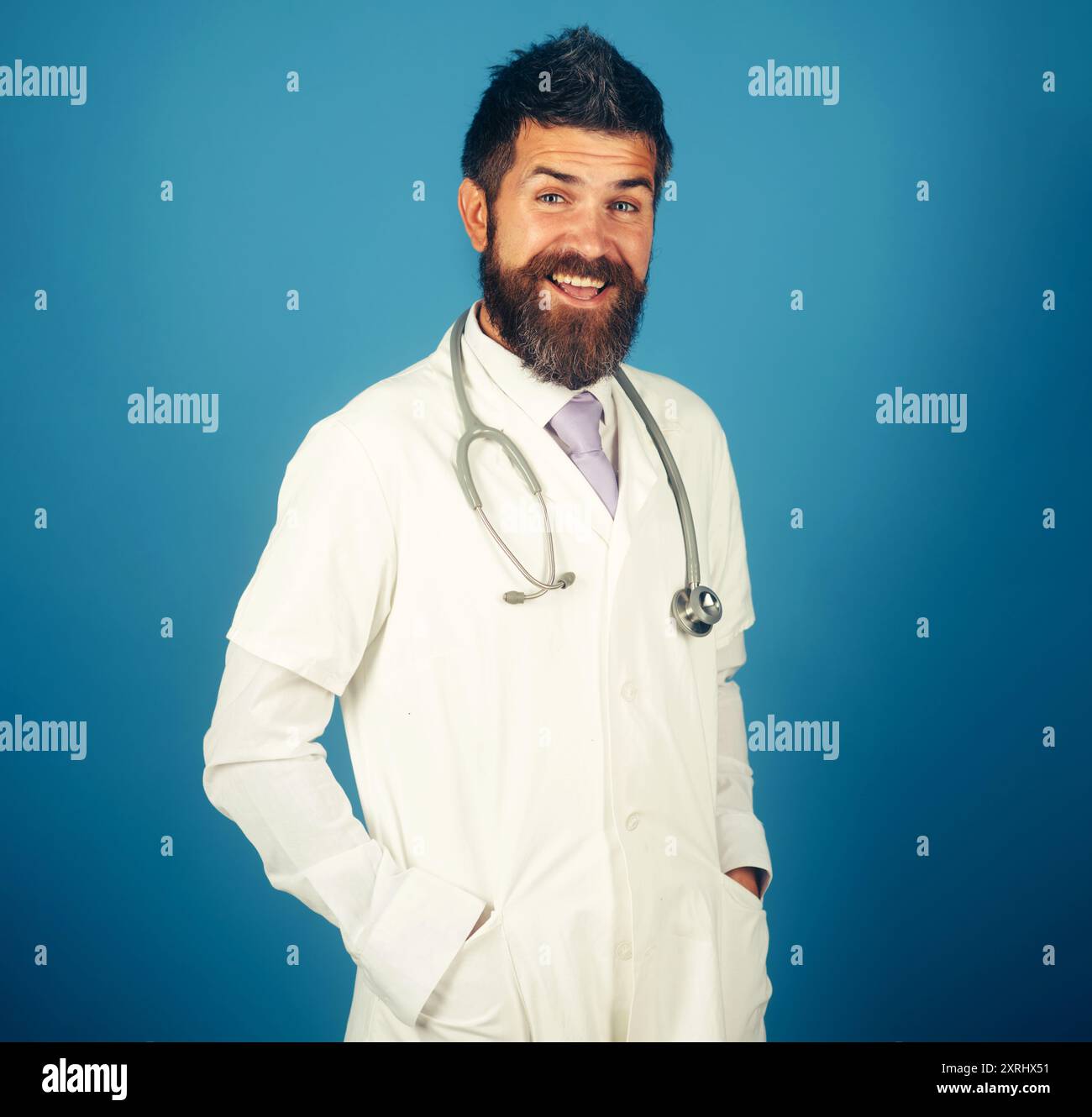 Portrait Of Smiling Male Doctor Or Physician In White Medical Coat With Portrait Of Smiling Male Doctor Or Physician In White Medical Coat With