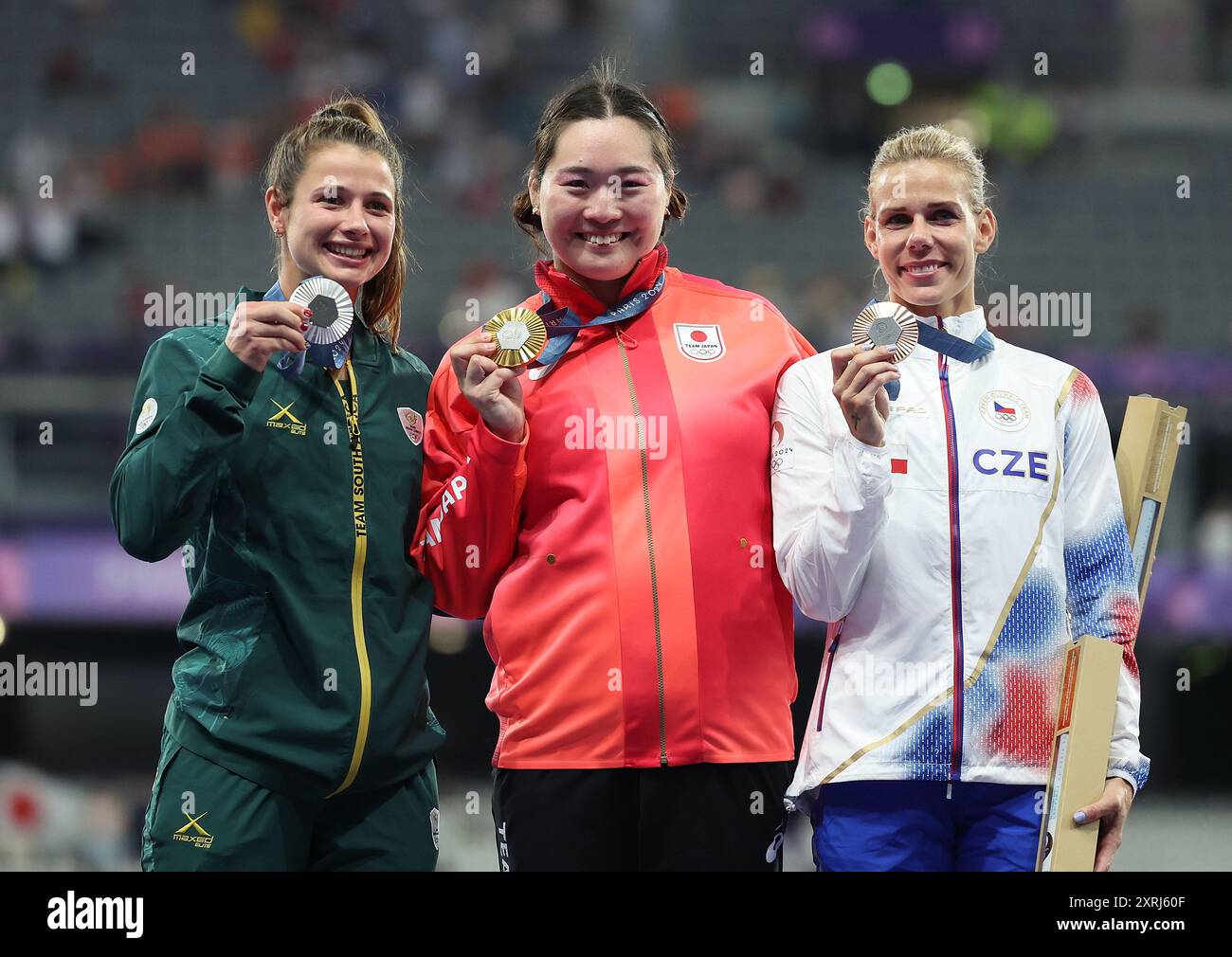 Paris, France. 10th Aug, 2024. Gold medalist Kitaguchi Haruka (C) of Japan, silver medalist Jo-Ane van Dyk (L) of South Africa and bronze medalist Nikola Ogrodnikova of Czech Republic react during the victory ceremony of the women's javelin throw of Athletics at the Paris 2024 Olympic Games in Paris, France, Aug. 10, 2024. Credit: Li Gang/Xinhua/Alamy Live News Stock Photo