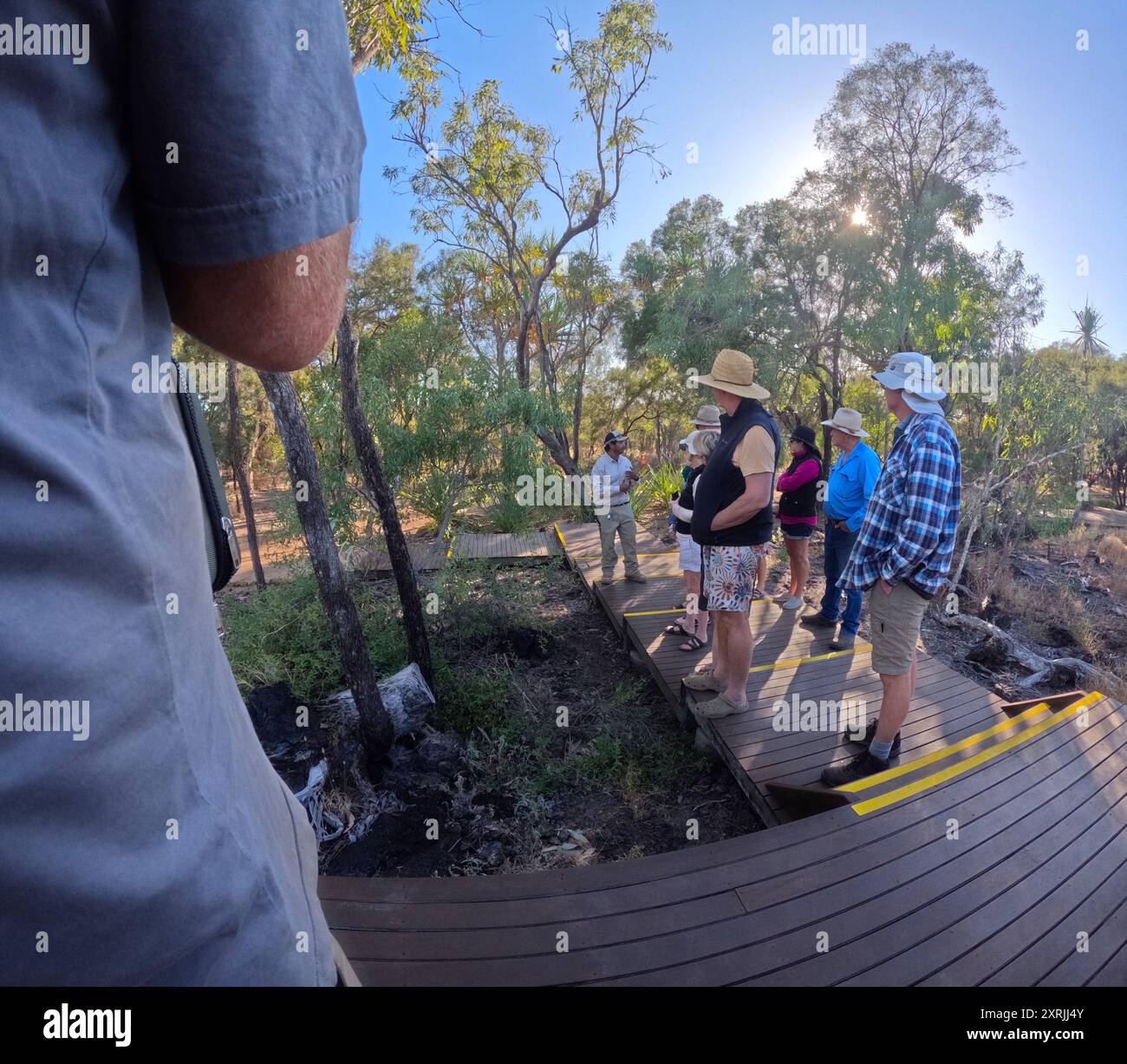 Tourists listening to Aboriginal Cultural Guide, Talaroo Hot Springs, outback Queensland, Australia. No MR or PR Stock Photo