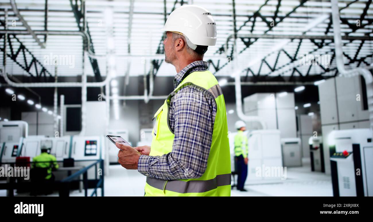 Inspection Engineer Worker At Construction Site Using Tablet Stock Photo