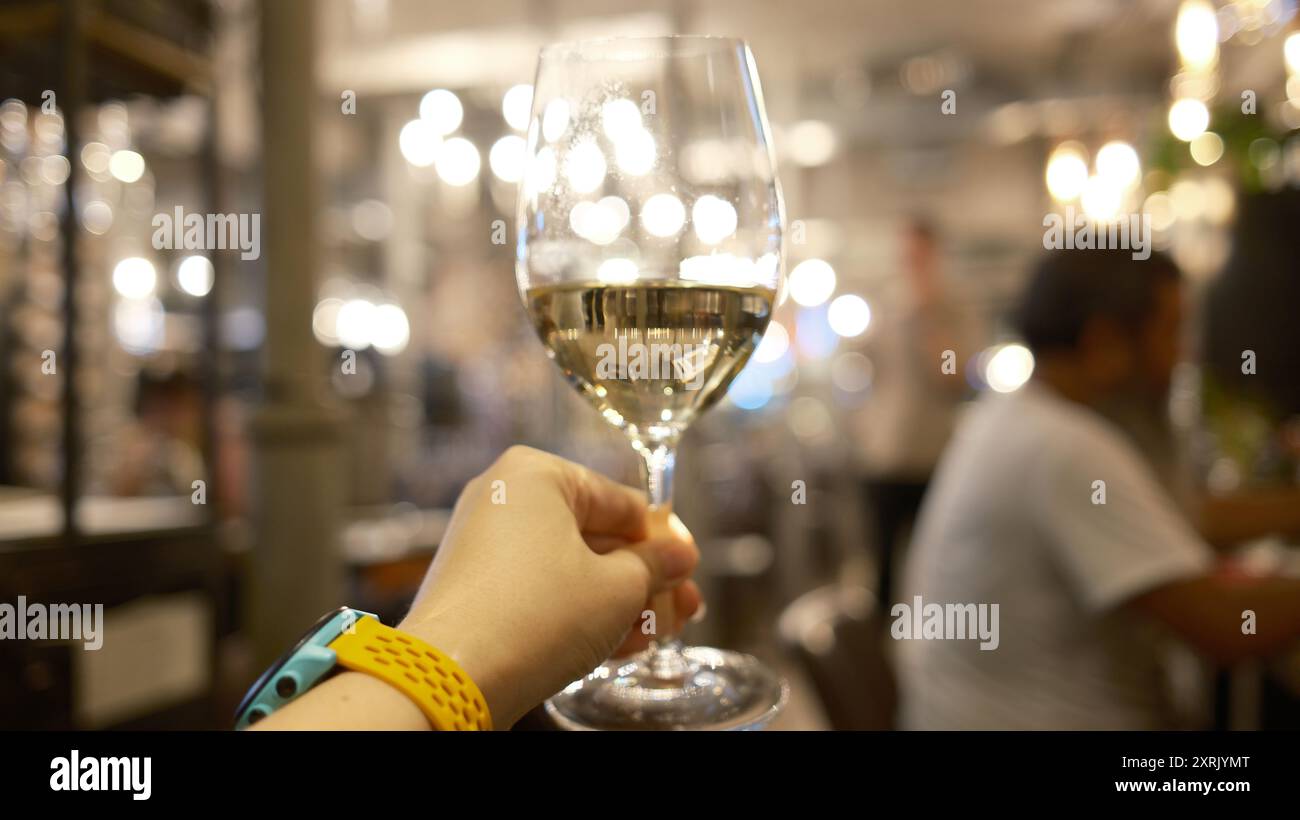 Woman holding glass of wine hi-res stock photography and images - Alamy