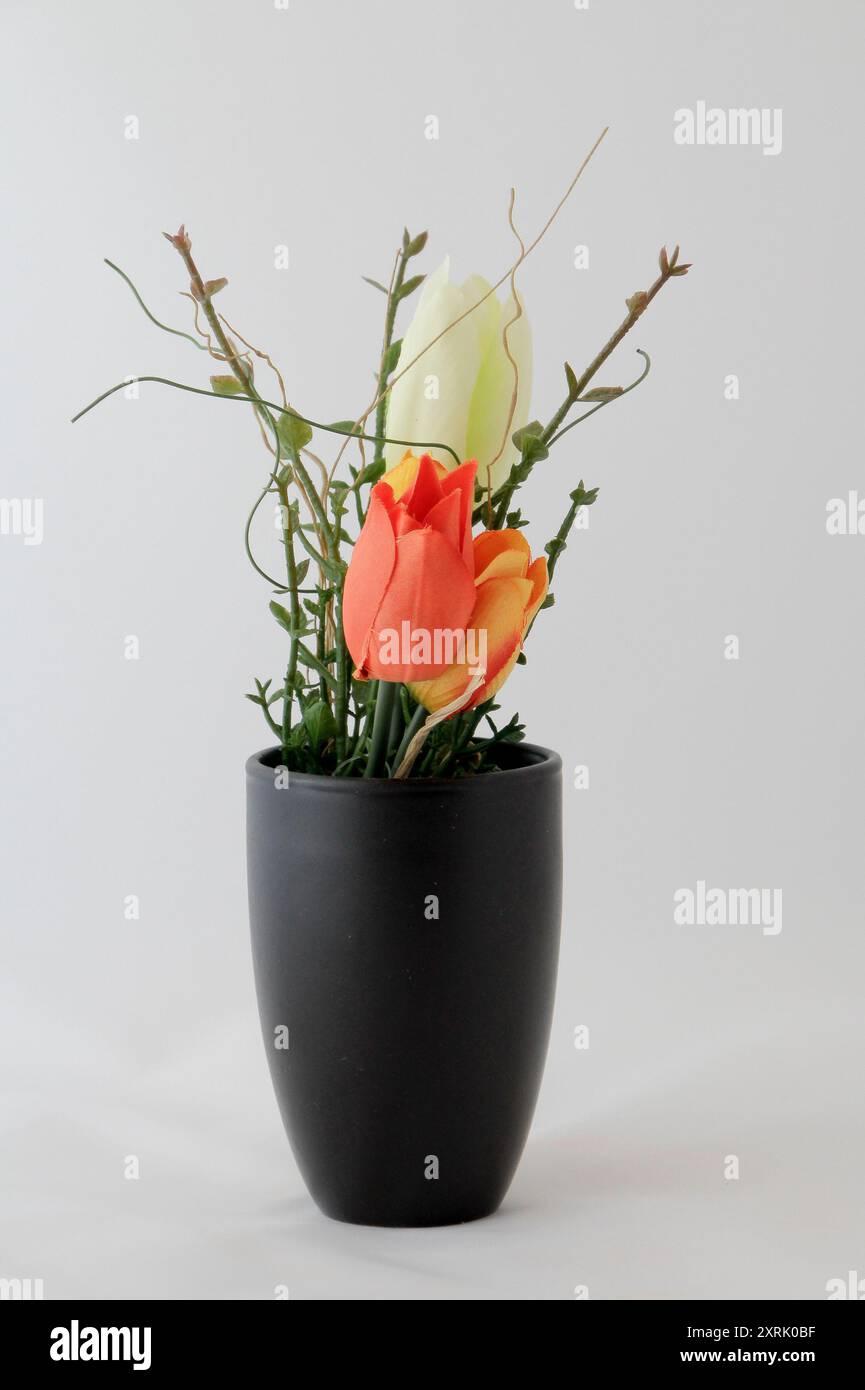 Artificial flowers as decoration in a vase Stock Photo