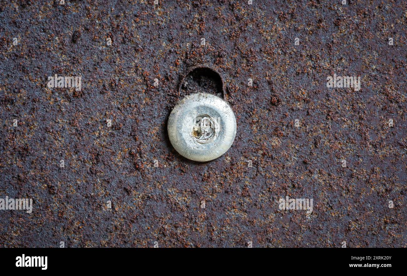 Macro close up metal thread on rusty surface Stock Photo