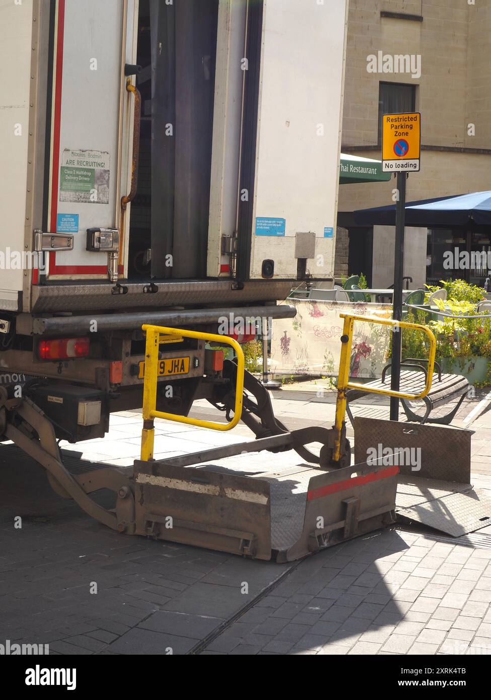 Lorry with tail lift and ramp in down position for loading or unloading ...