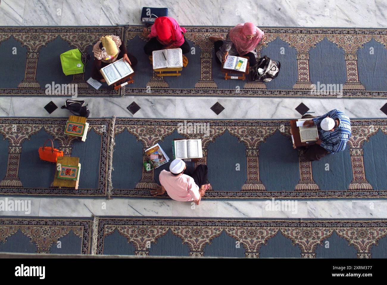 view from above of Muslim children reciting the Koran in the mosque ...