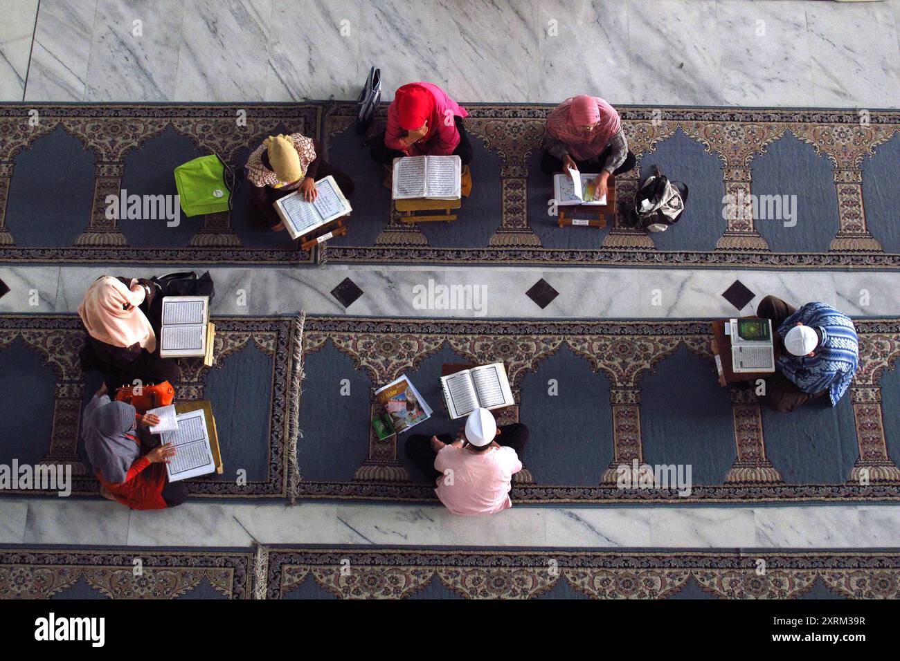 view from above of Muslim children reciting the Koran in the mosque ...