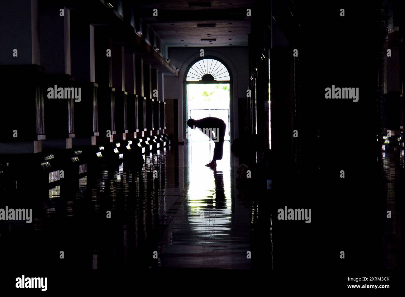 silhouette of a Muslim man praying in the mosque Stock Photo - Alamy