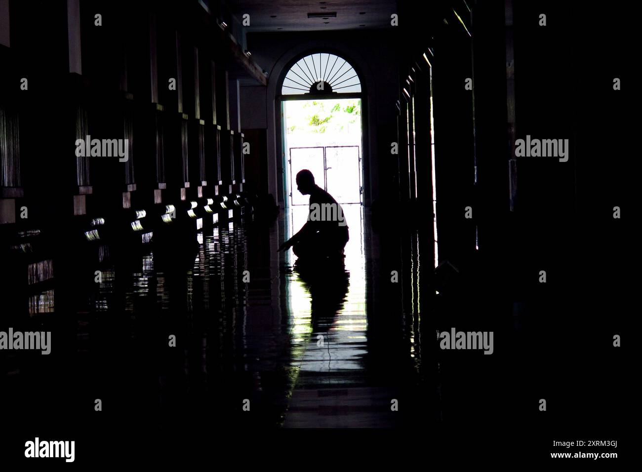 silhouette of a Muslim man praying in the mosque Stock Photo - Alamy