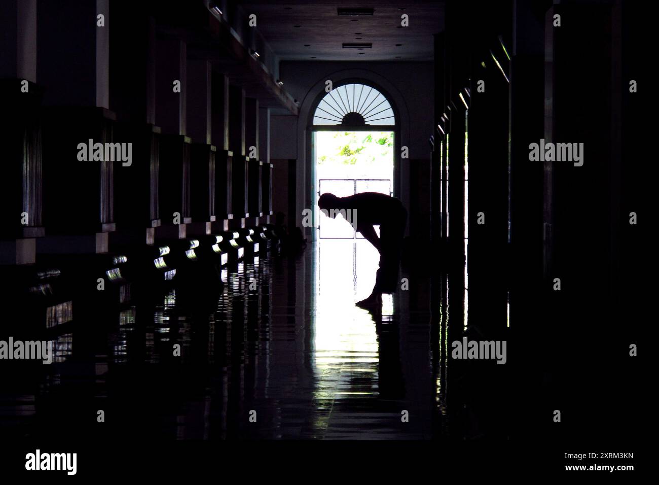 silhouette of a Muslim man praying in the mosque Stock Photo - Alamy