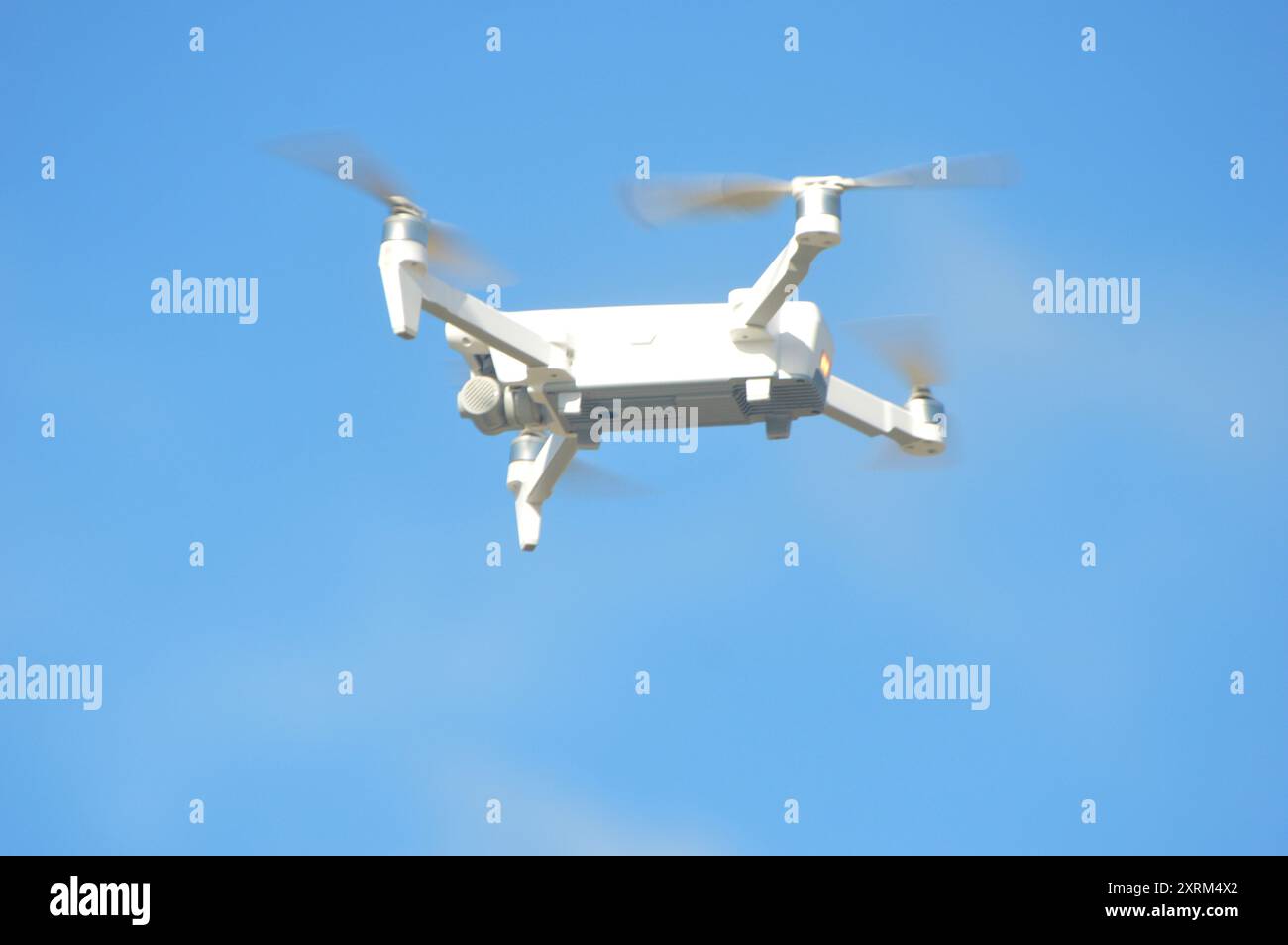 drone hovering in the blue sky air Stock Photo