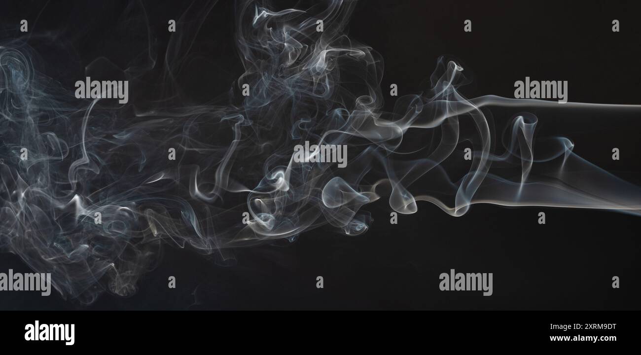 Abstract silky smoke background on black backdrop Stock Photo