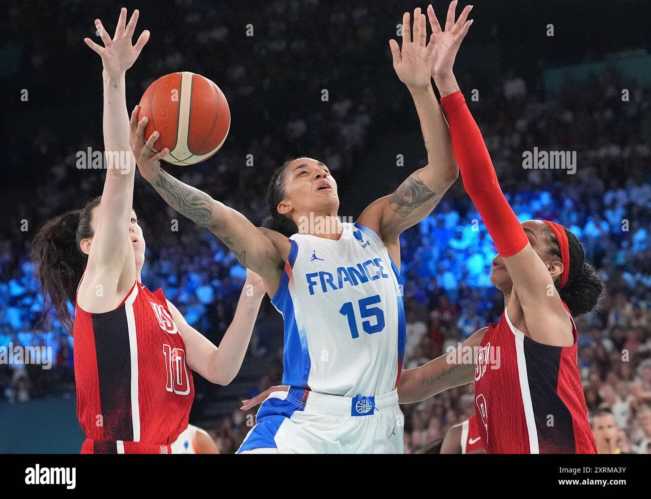 Paris, France. 11th Aug, 2024. Gabby Williams of France (15) tries to shoot over Breanna Stewart (10) and A'Ja Wilson of the U.S. (9) during the Women's Basketball gold medal game at the Paris 2024 Olympic Games at the Bercy Arena in Paris, France, on Sunday, August 11, 2024. Photo by Richard Ellis/UPI Credit: UPI/Alamy Live News Stock Photo