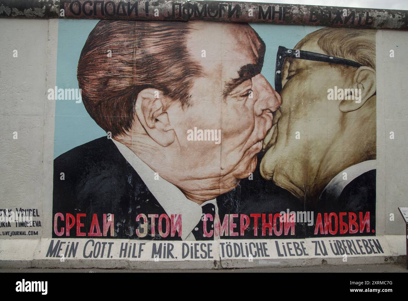 Painting of Leonid Brezhnev & Erich Honecker’s kiss on the Berlin Wall in East Side Gallery in Berlin, Germany, Europe; Dmitri Vrubel’s Fraternal Kiss Stock Photo