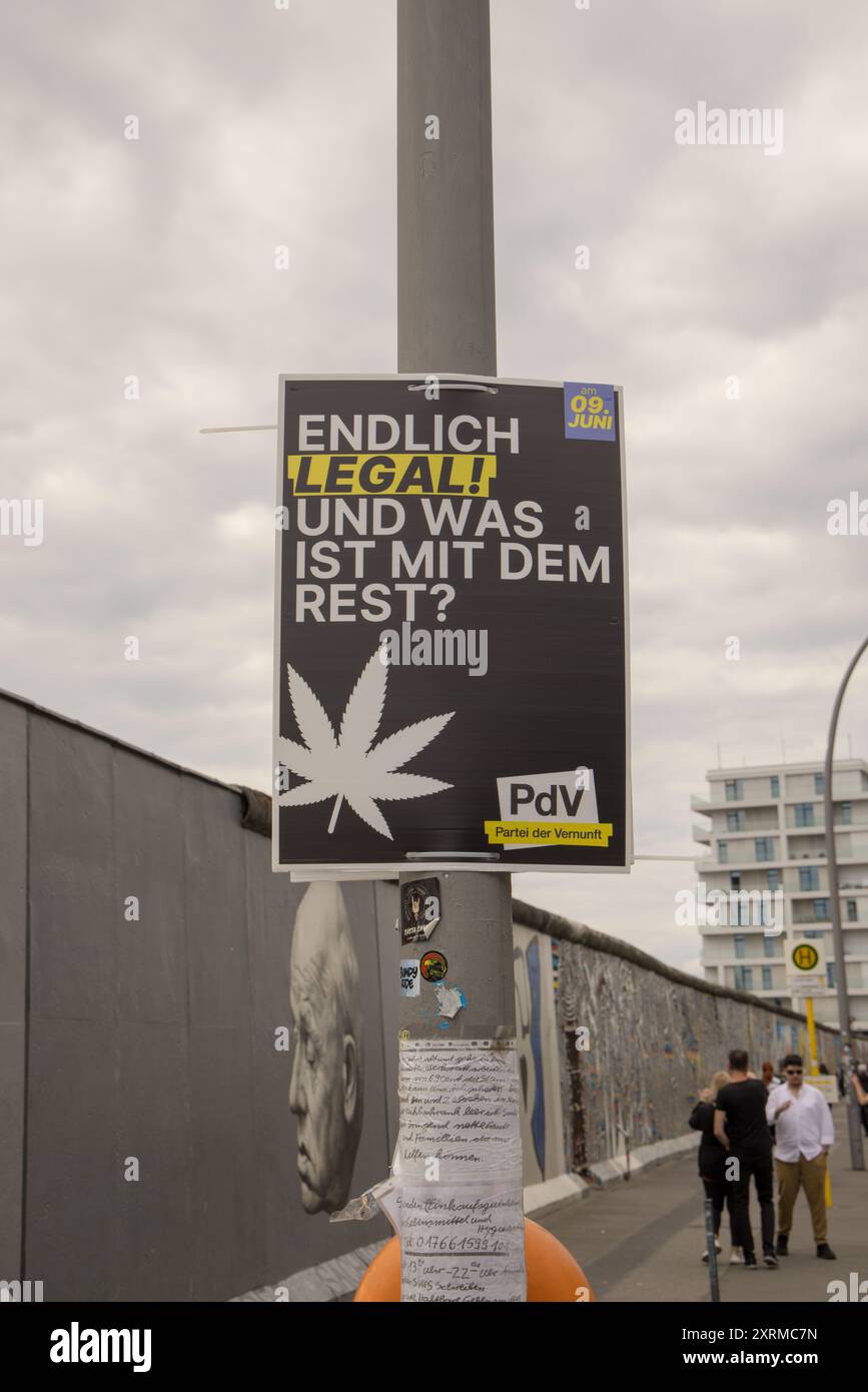 Election poster of the PdV with text "Endlch legal! und was ist mit dem Rest?" at street pole