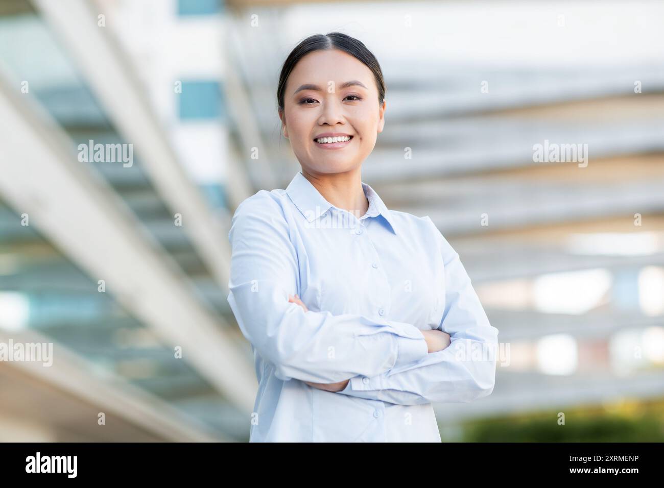 Smiling asian woman arms hi-res stock photography and images - Alamy